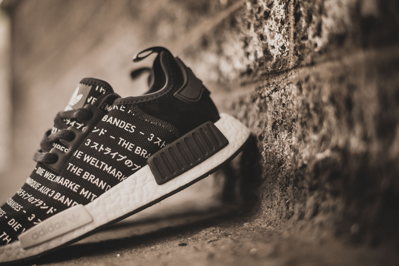 white nmd with writing